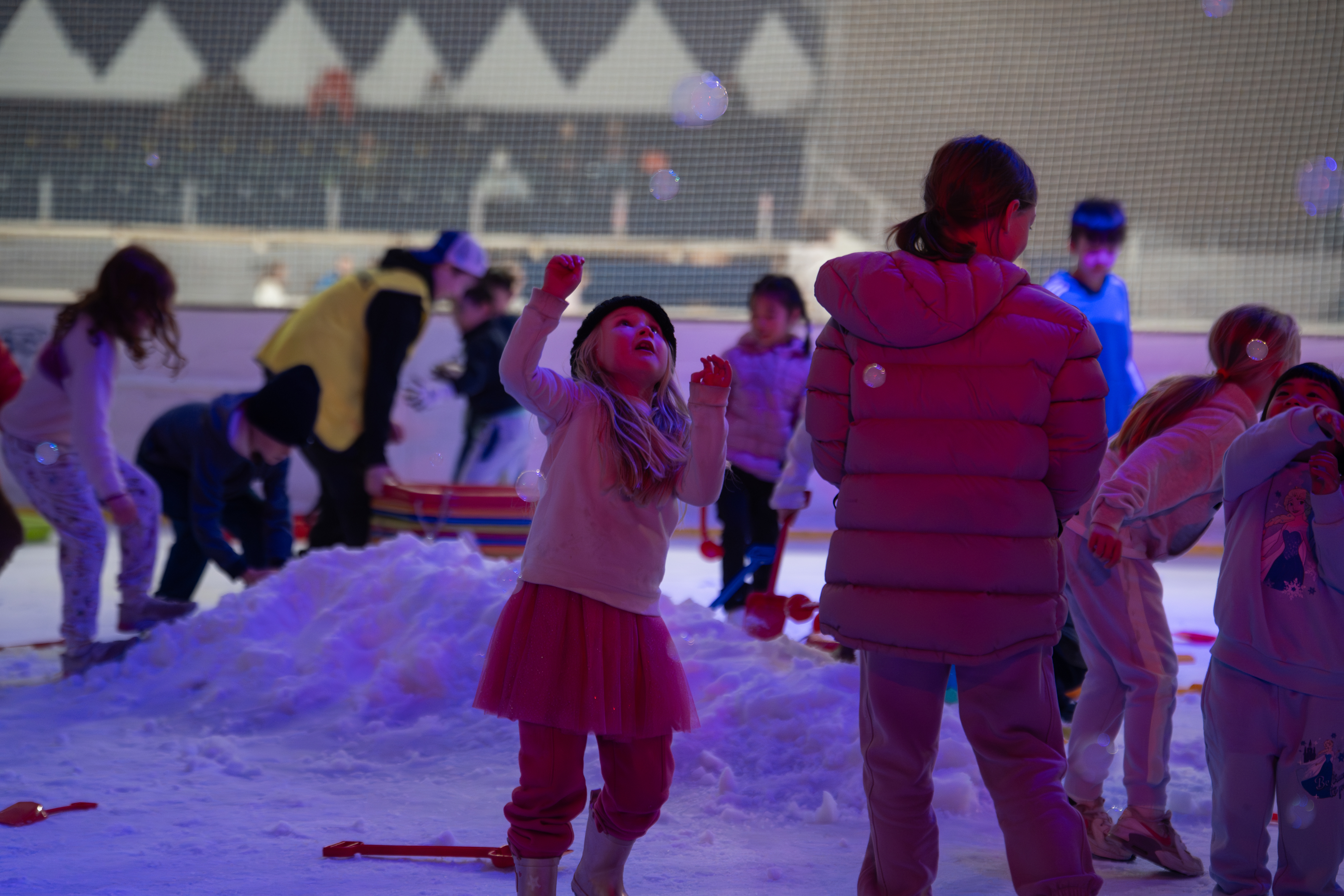 Children enjoying an ice skating event